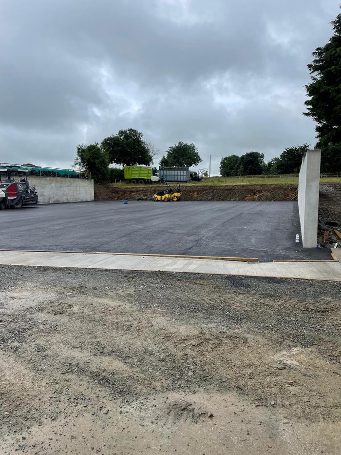 The finished silage pit apron between the concrete walls, ready for use.